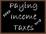Paying Income Taxes on chalk board
