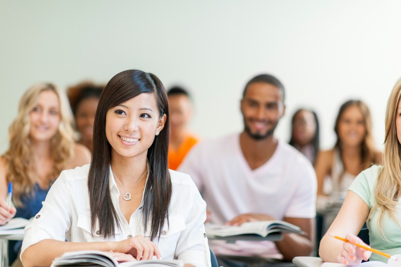 Diverse group of university students in classroom