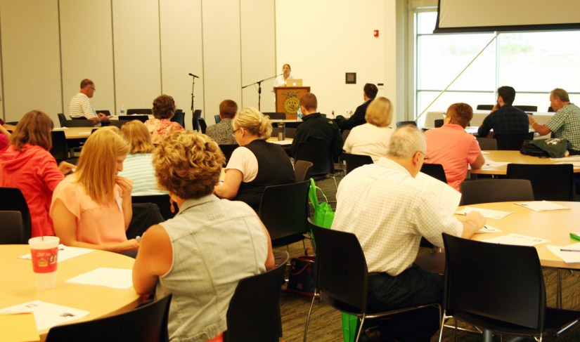 Iowa Jump$tart President Mary Sandvig welcomes attendees to the Educators Conference. 